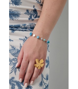 Goudkleurige armband met blauwe kralen - Glamour voor elke outfit